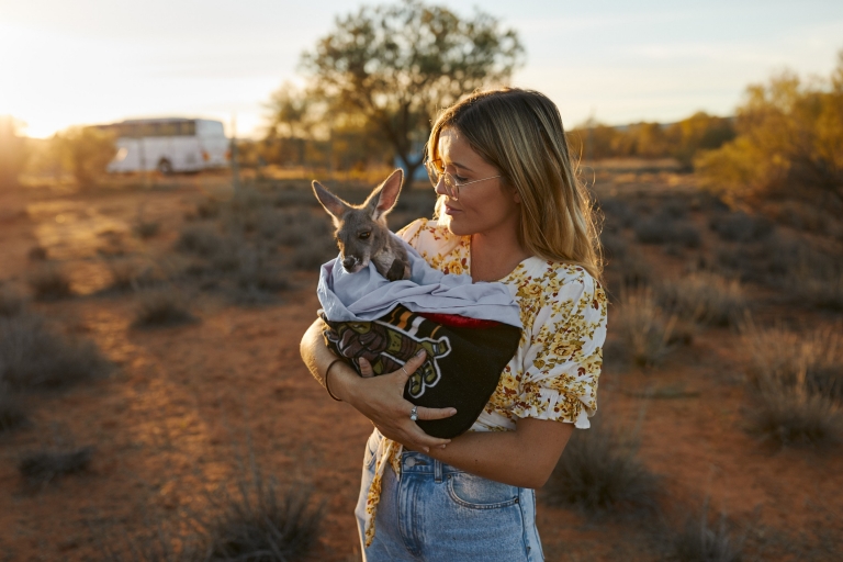 Holding a Baby Kangaroo at The Kangaroo Sanctuary, Alice Springs, NT © Tourism NT/Matt Cherubino 2019